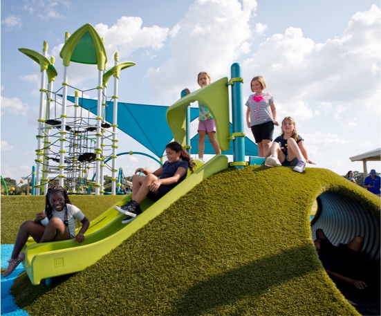 Carrollwood Village Park featuring a PlayMound™ covered in Playground Grass synthetic turf by ForeverLawn Carrollwood Village Park featuring a PlayMound™ covered in Playground Grass synthetic turf by ForeverLawn