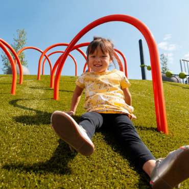 Girl sliding down PG grass Girl sliding down PG grass