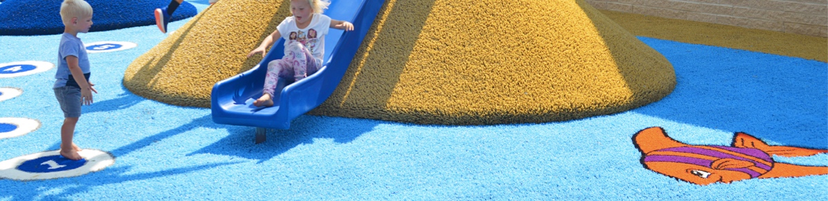 Children playing on Playground Grass Funscapes at Lake YMCA